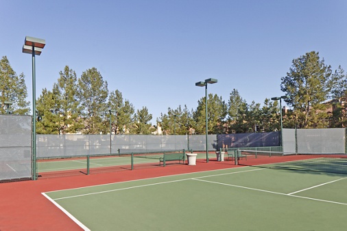 Exterior view of tennis courts at Santa Clara Apartment Homes in Irvine, CA.
