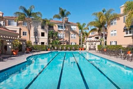 Daytime exterior view of pool at Santa Clara Apartment Homes in Irvine, CA.