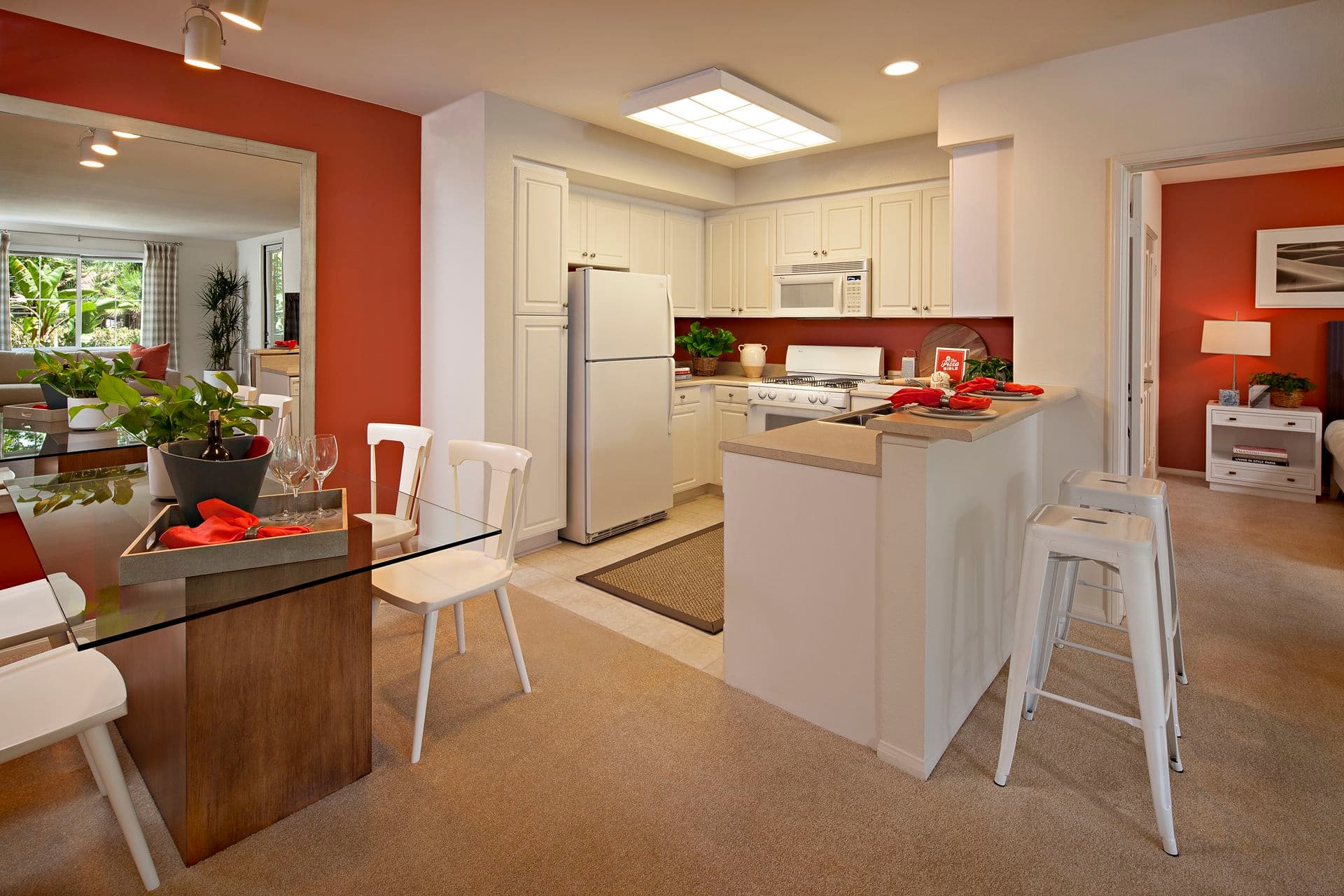 Interior view of kitchen and dining room at Serrano Apartment Homes in Irvine, CA.