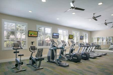 Interior view of fitness center at Serrano Apartment Homes in Irvine, CA.