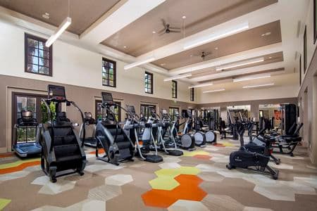 Interior view of fitness center at Delrey at The Village at Irvine Spectrum Apartment Homes in Irvine, CA.