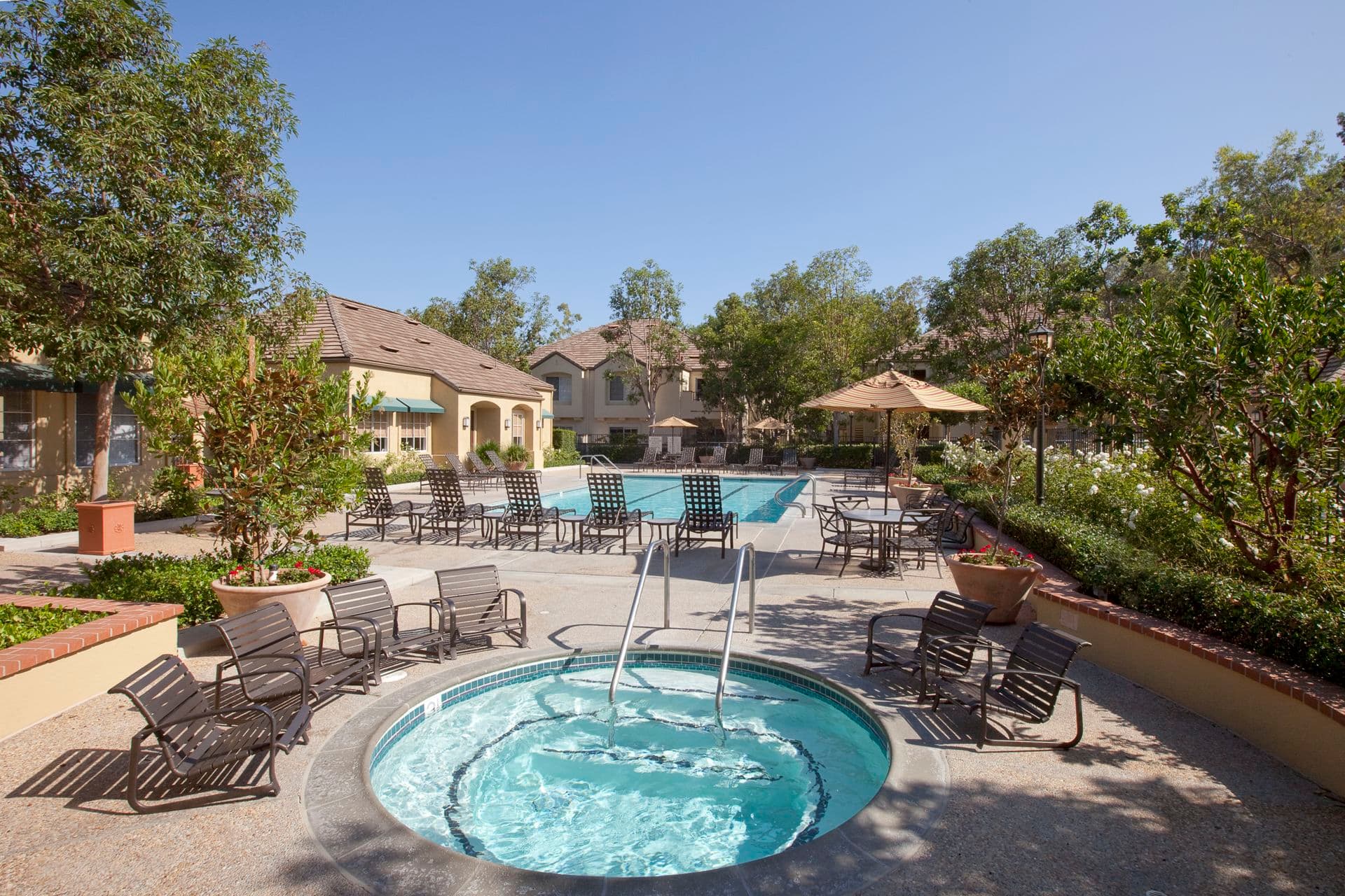 Exterior view of pool and spa at Turtle Rock Canyon Apartment Homes in Irvine, CA.