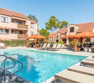 Pool view at Berkeley Court Apartment Homes at University Town Center in Irvine, CA.