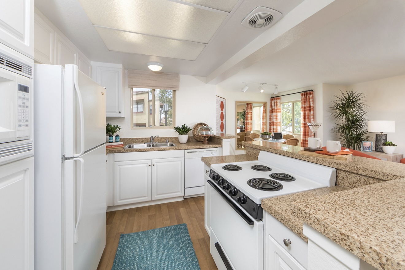 Interior view of kitchen at Dartmouth Court Apartment Homes at Town Center in Irvine, CA.