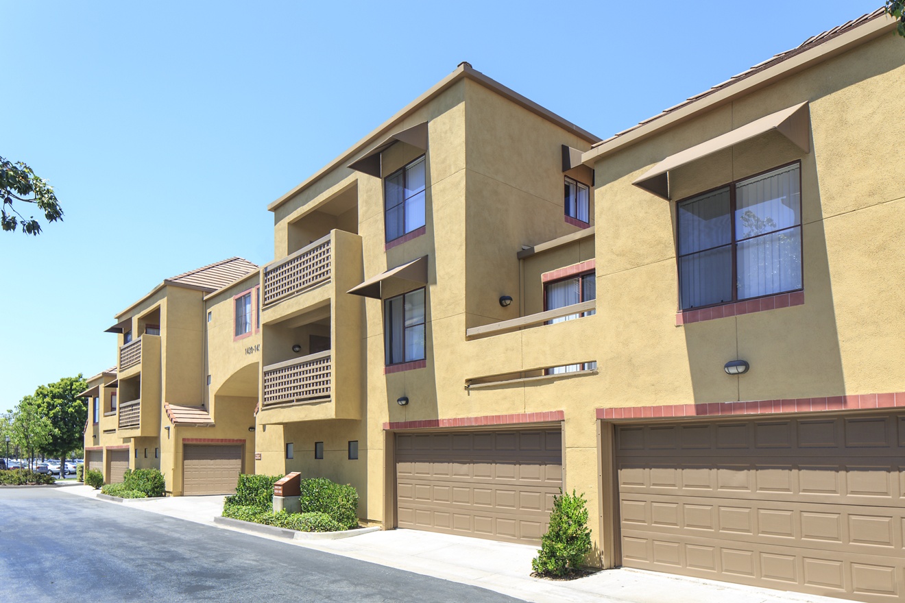 Exterior view of garage spaces at Dartmouth Court Apartment Homes at University Town Center in Irvine, CA.