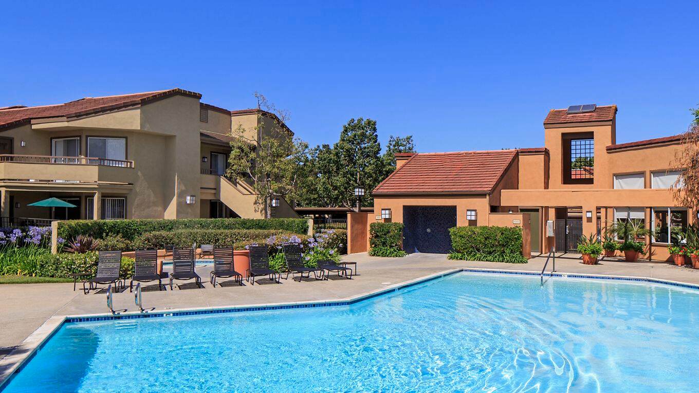 View of pool area at Harvard Court Apartment Homes at University Town Center in Irvine, CA.