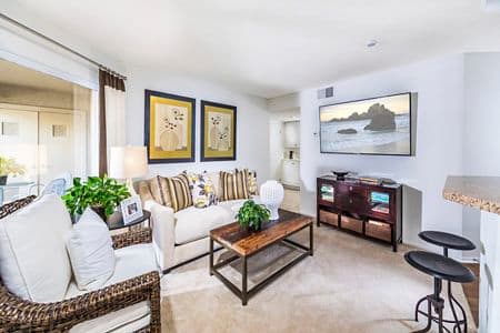 Interior view of living room at Stanford Court Apartment Homes at University Town Center in Irvine, CA.