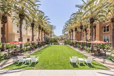 Exterior view of outdoor seating in courtyard at Villa Siena Apartment Homes in Irvine, CA.