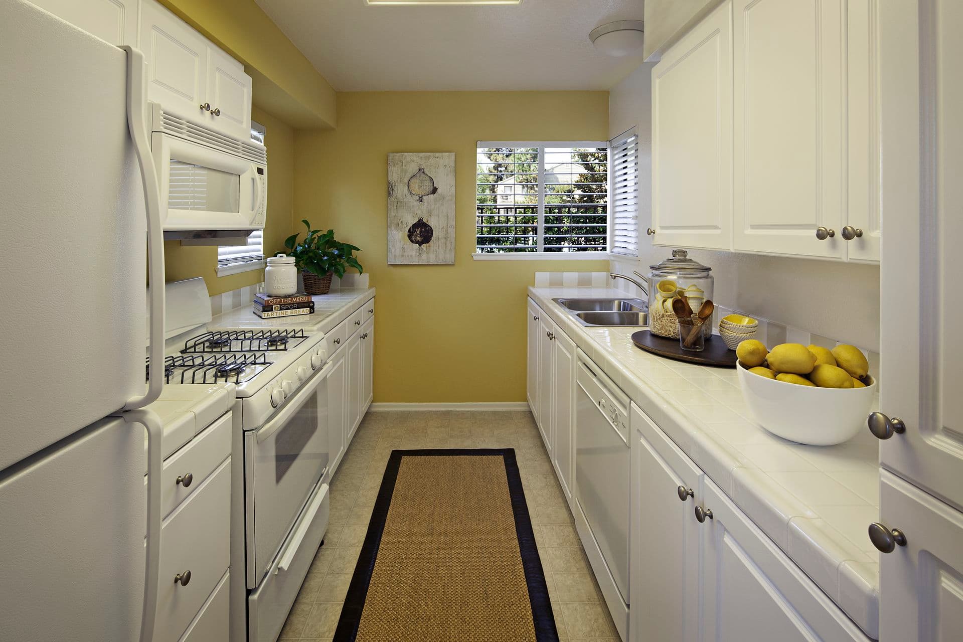 Interior view of kitchen at Windwood Knoll Apartment Homes in Irvine, CA.