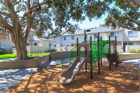 Exterior view of playground at Woodbridge Villas Apartment Homes in Irvine, CA.