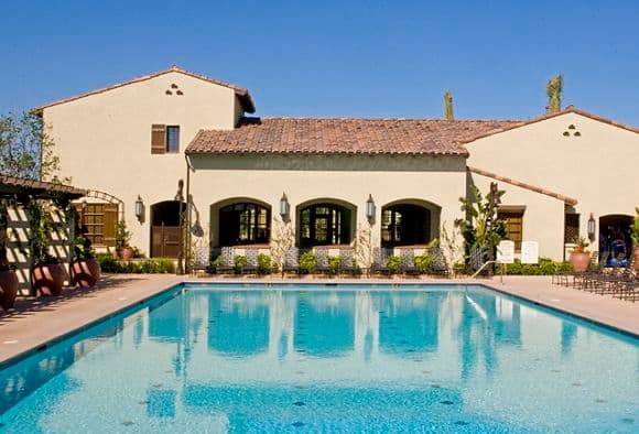 Exterior view of pool at Woodbury Court Apartment Homes in Irvine, CA.