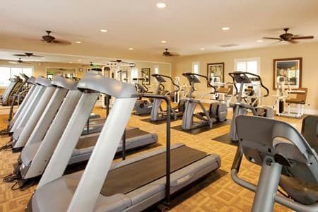 Interior view of fitness center at Woodbury Lane Apartment Homes in Irvine, CA.