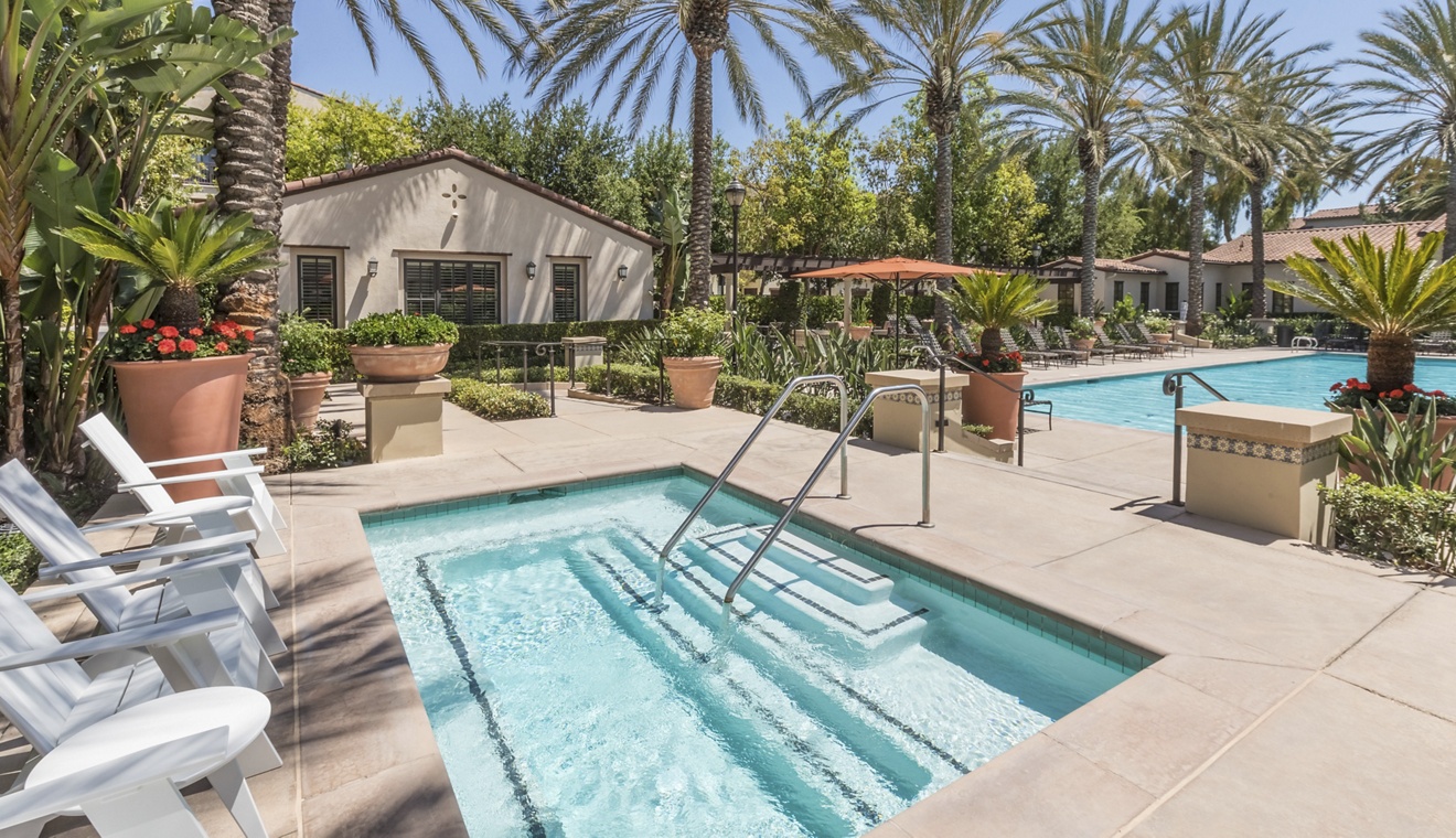 Exterior view of pool at Woodbury Lane Apartment Homes in Irvine, CA.