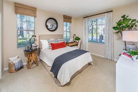 Interior view of bedroom at Woodbury Lane Apartment Homes in Irvine, CA.