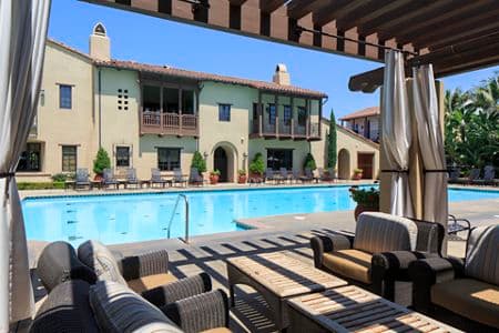 Exterior view of pool at Woodbury Place Apartment Homes in Irvine, CA.