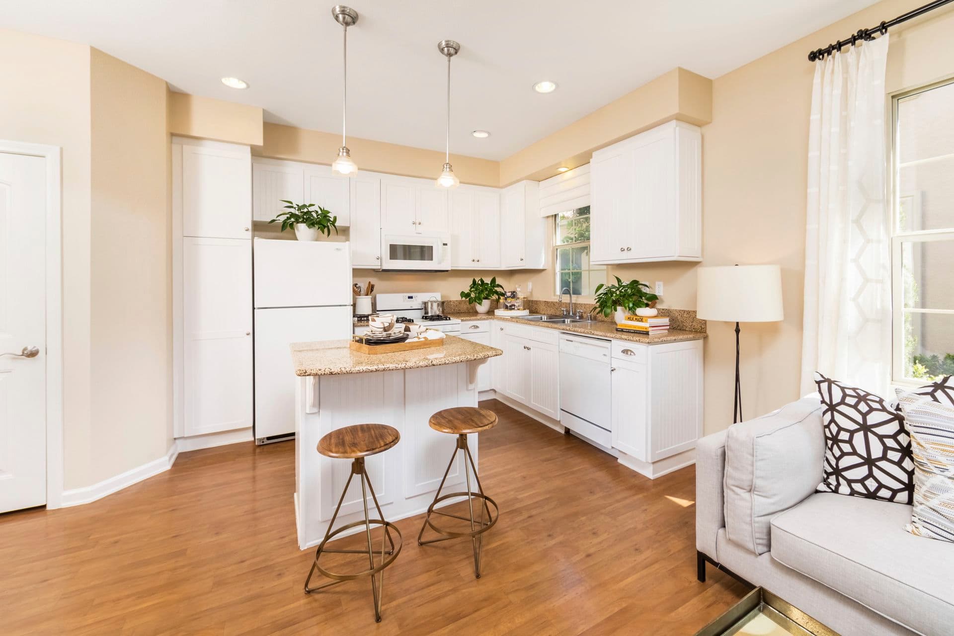 Interior view of kitchen at Woodbury Place Apartment Homes in Irvine, CA.
