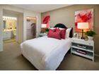 Interior view of bedroom at Woodbury Square Apartment Homes in Irvine, CA.