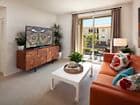 Interior view of living room at Woodbury Square Apartment Homes in Irvine, CA.