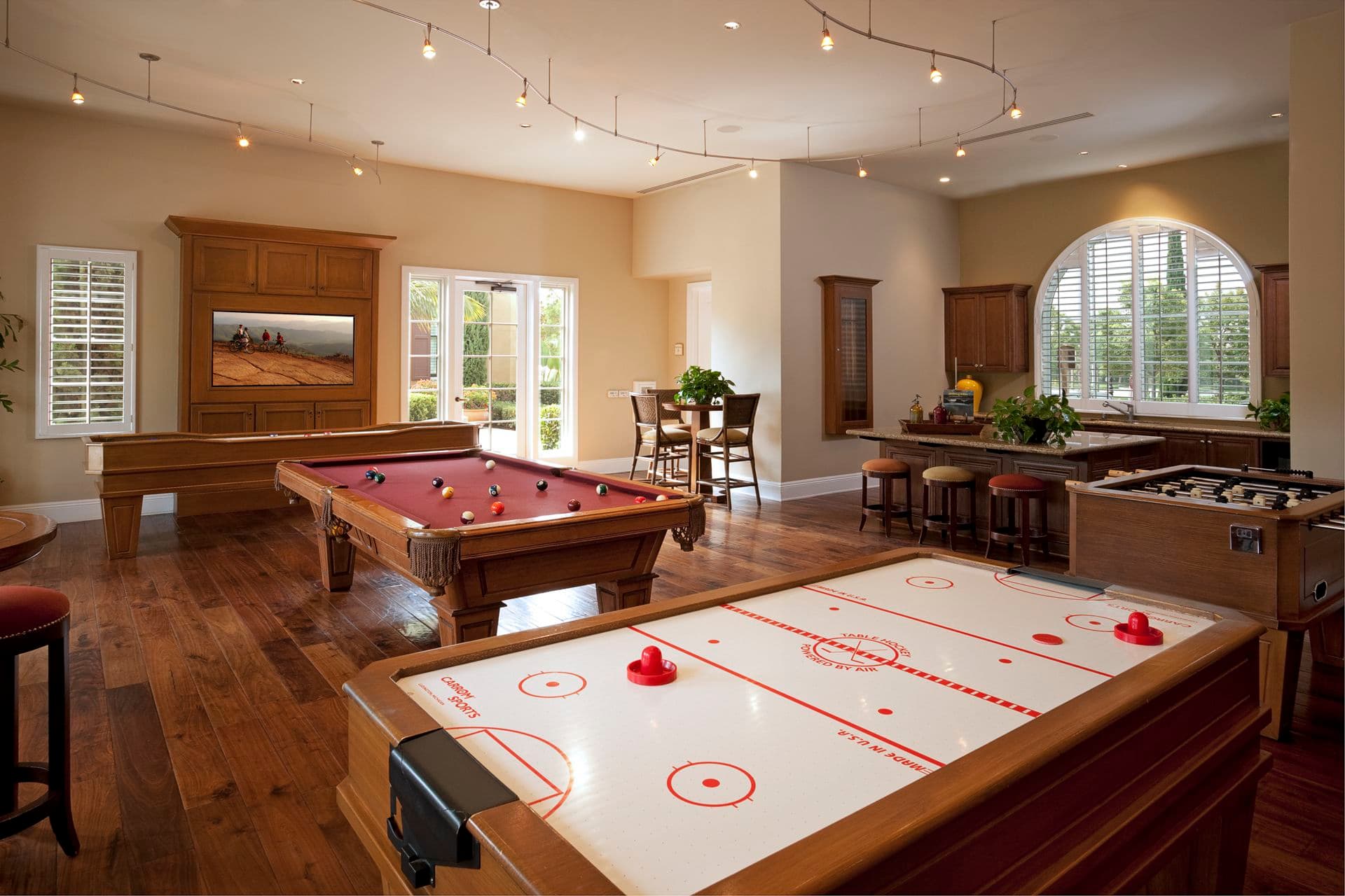 Interior view of game room at Woodbury Square Apartment Homes in Irvine, CA.