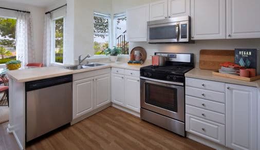 Interior view of kitchen at Vista Real Apartment Homes in Mission Viejo, CA.