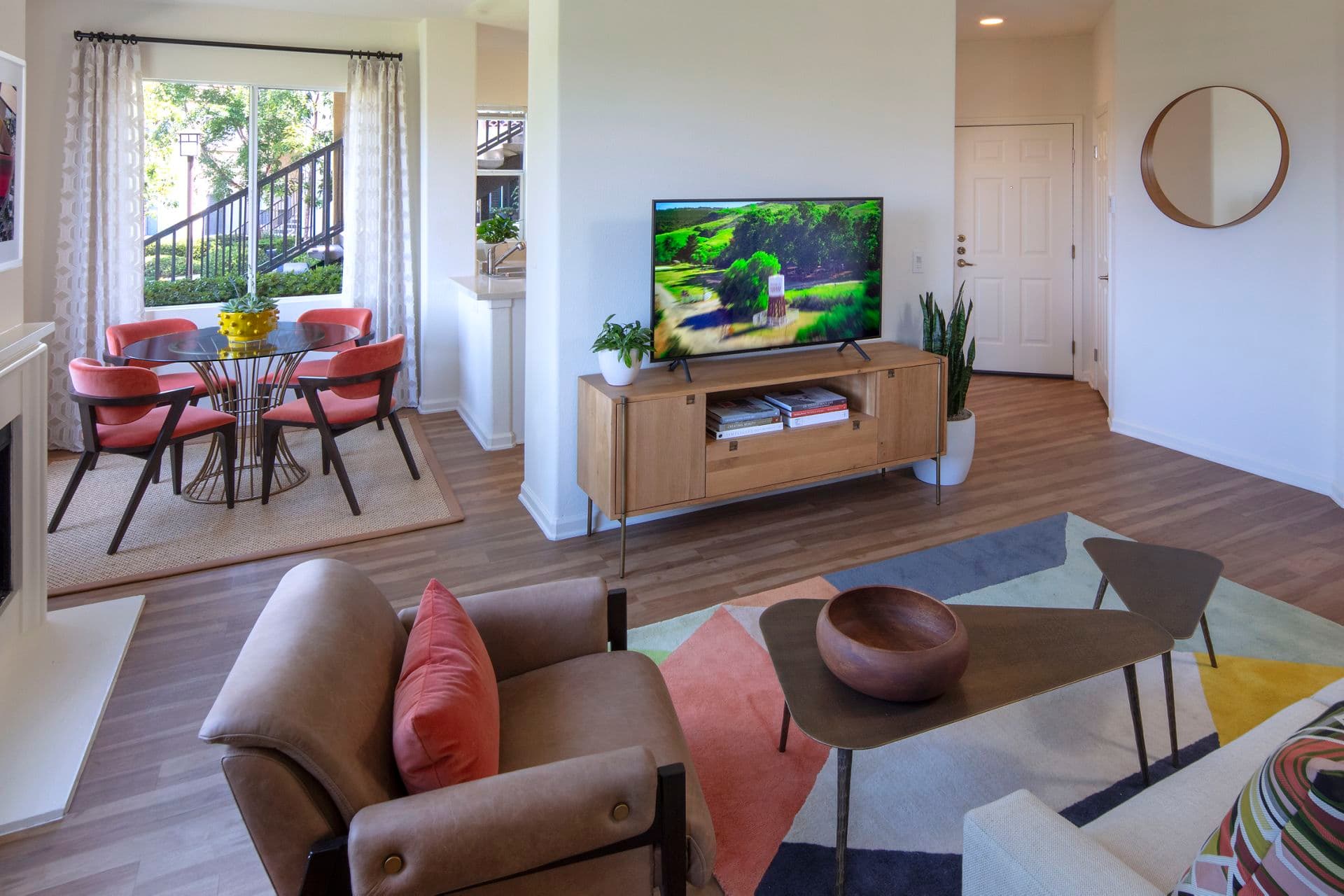 Interior view of living room and dining room at Vista Real Apartment Homes in Mission Viejo, CA.