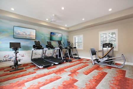 Interior view of fitness center at Baypointe Apartment Homes in Newport Beach, CA.