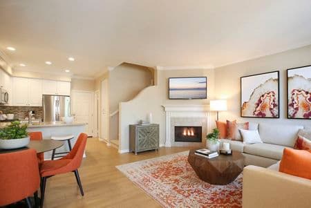 Interior view of living room and dining room at Bordeaux Apartment Homes in Newport Beach, CA.