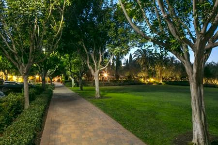 Evening view of the park at Newport Bluffs Apartment Homes in Newport Beach, CA. 