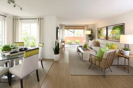 Interior view of living room and dining room at Newport North Apartment Homes in Newport Beach, CA.