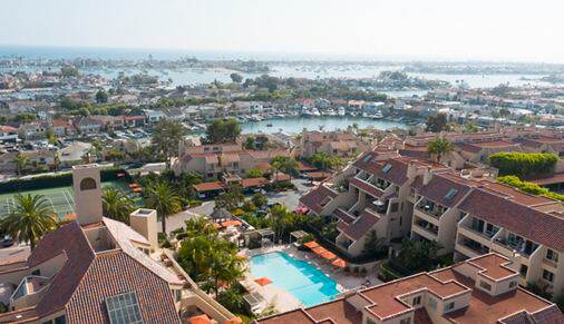 Exterior drone shot of Promontory Point Apartment Communities in Newport Beach, CA.