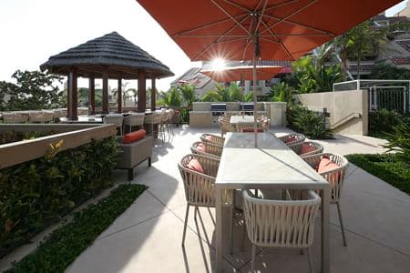 Exterior view of outdoor seating area at Promontory Point Apartment Communities in Newport Beach, CA.