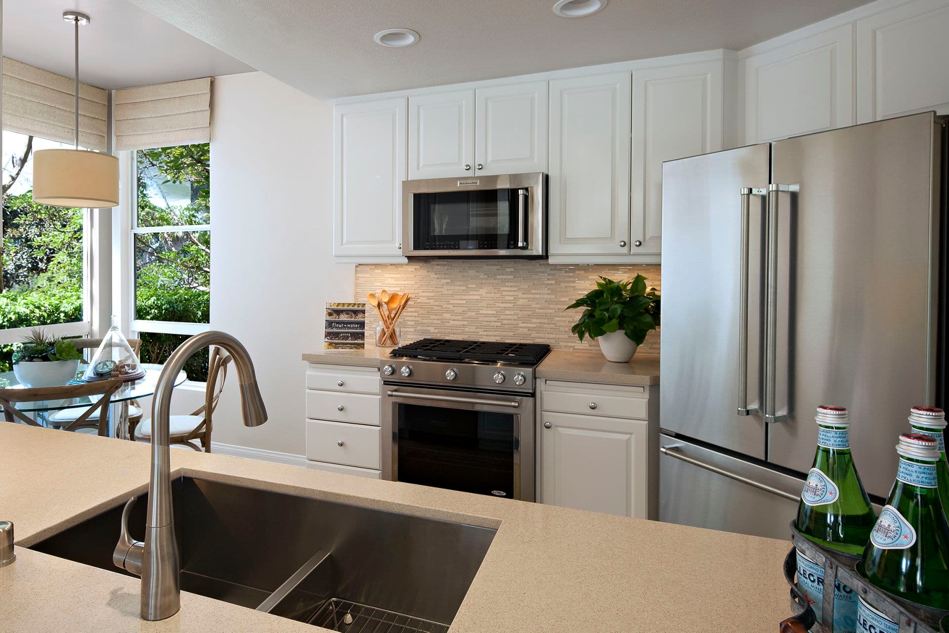Interior view of kitchen at The Colony at Fashion Island Apartment Homes in Newport Beach, CA.