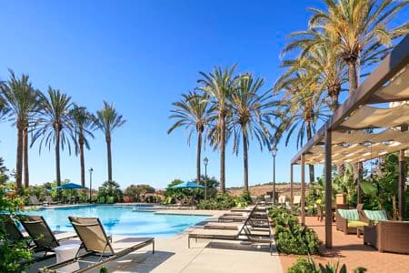 Exterior view of the pool at Las Flores Apartment Homes in Rancho Santa Margarita, CA.
