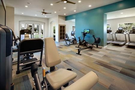 Interior view of the fitness center at at Las Flores Apartment Homes in Rancho Santa Margarita, CA.