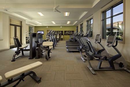 Interior view of fitness center at Amalfi Apartment Homes in Tustin, CA.