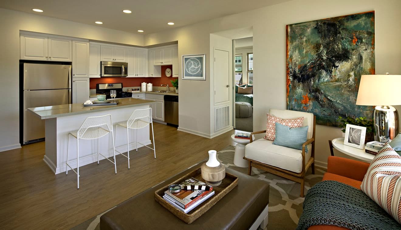 Interior views of living room and kitchen at Amalfi Apartment Homes in Tustin, CA.