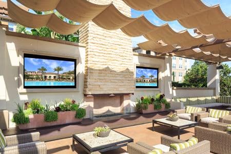Exterior view of outdoor patio and lounge area at Amalfi Apartment Homes in Tustin, CA.