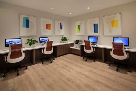 Interior view of business center iLounge at Rancho Mariposa Apartment Homes in Tustin, CA.