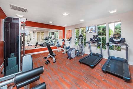Interior view of fitness center at Rancho Mariposa Apartment Homes in Tustin, CA.