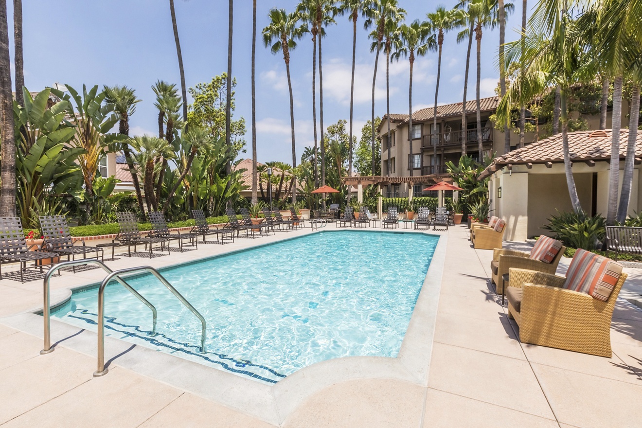 Exterior view of pool at Rancho Mariposa Apartment Homes in Tustin, CA.