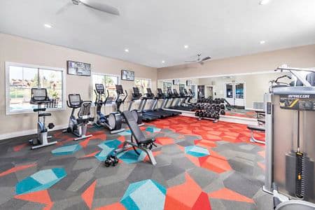 Interior view of fitness center at Rancho Monterey Apartment Homes in Tustin, CA.