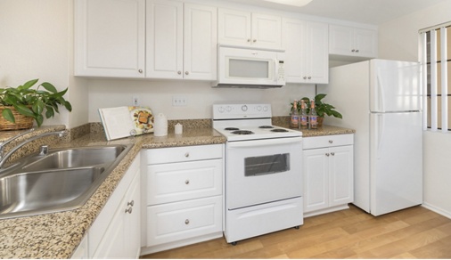 Interior view of kitchen at Rancho Tierra Apartment Homes in Tustin, CA.