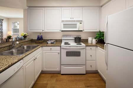 Interior view of kitchen at Sierra Vista Apartment Homes in Tustin, CA.