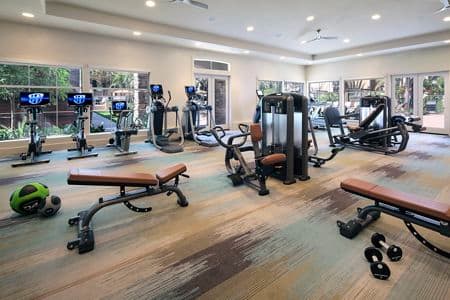 Interior view of fitness center at Del Rio Apartment Homes in Mission Valley, CA.