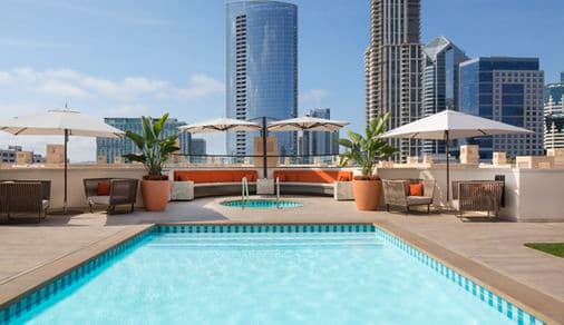 Exterior view of roof deck pool at Harborview Apartment Homes in San Diego, CA.