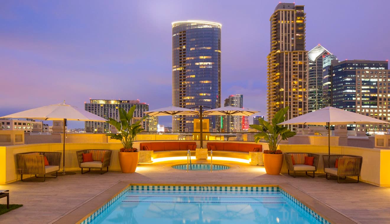 Exterior view of rooftop pool at Harborview Apartment Homes in San Diego, CA.