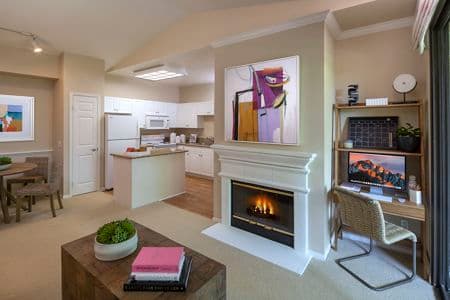 Interior view of kitchen, living, and dining at Monte Vista Apartment Homes in Mission Valley, CA.