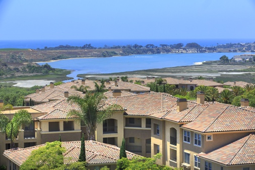 Exterior view of lagoon and ocean at Pacific View Apartment Homes in San Diego, CA.