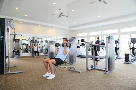 People exercising at fitness center at Pacific View Apartment Homes in Carlsbad, CA.