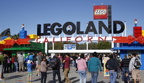 San Diego, CA, USA - December 29th, 2013: A crowd of visitors entering and exiting the entrance of the Legoland California theme park located in San Diego, California.